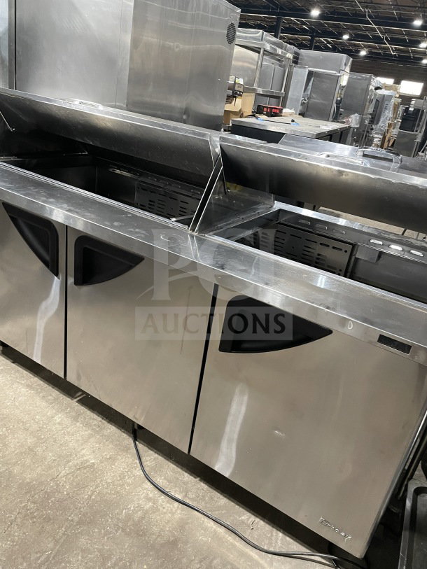 Turbo Air TST-72SD-30-N refrigerated prep table, stainless steel, 3-door, bain marie style, with cutting board, on casters.