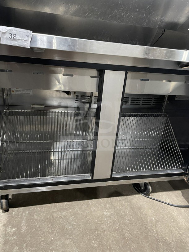 Turbo Air Super Deluxe 3-Door Refrigerated Prep Table, Model TST-72SD-30-N, stainless steel, with wired racks and cutting board.