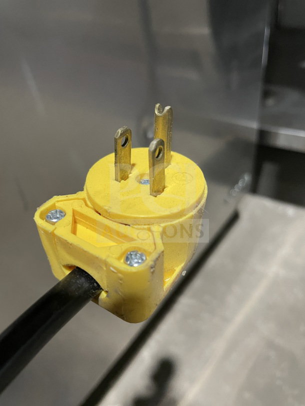 Close-up of a yellow electrical plug for Turbo Air TST-72SD-30-N refrigerated prep table.