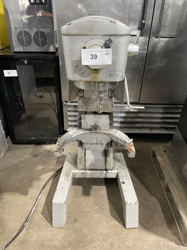 Uniworld commercial stainless steel planetary mixer in fair condition, visible wear. Tag shows auction number 39.