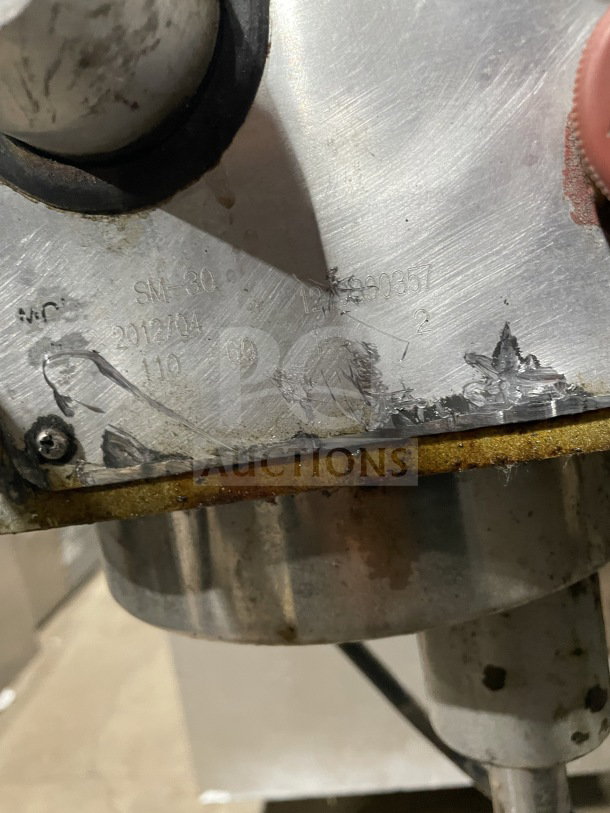 Uniworld stainless steel planetary mixer, model SM-30. Visible wear and markings on the surface, label indicates specs.