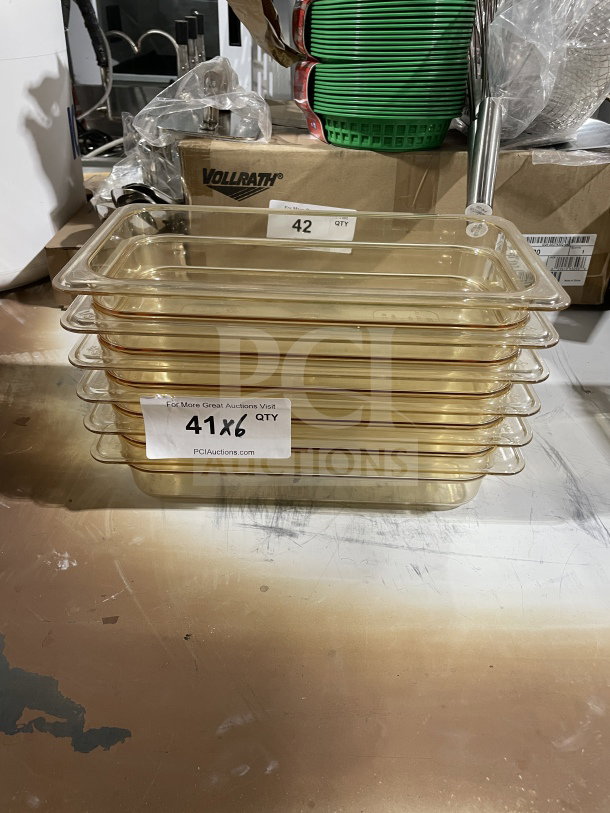 Cambro yellow polycarbonate food pans, model 631-1, stack of six, high heat resistant, commercial-grade, clear with labels.