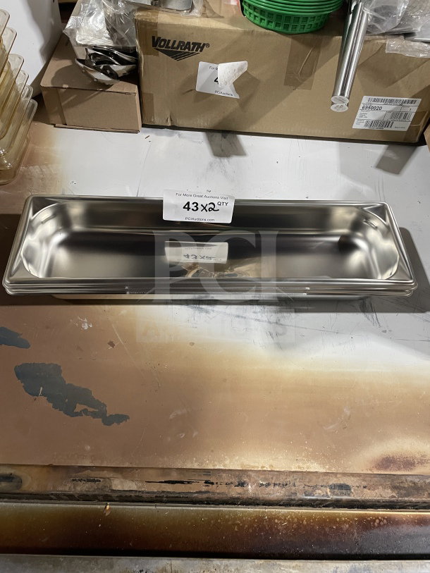 Brand new Vollrath stainless steel full-size steam pan, model 90322, shiny finish, pristine condition, auction display with tag.