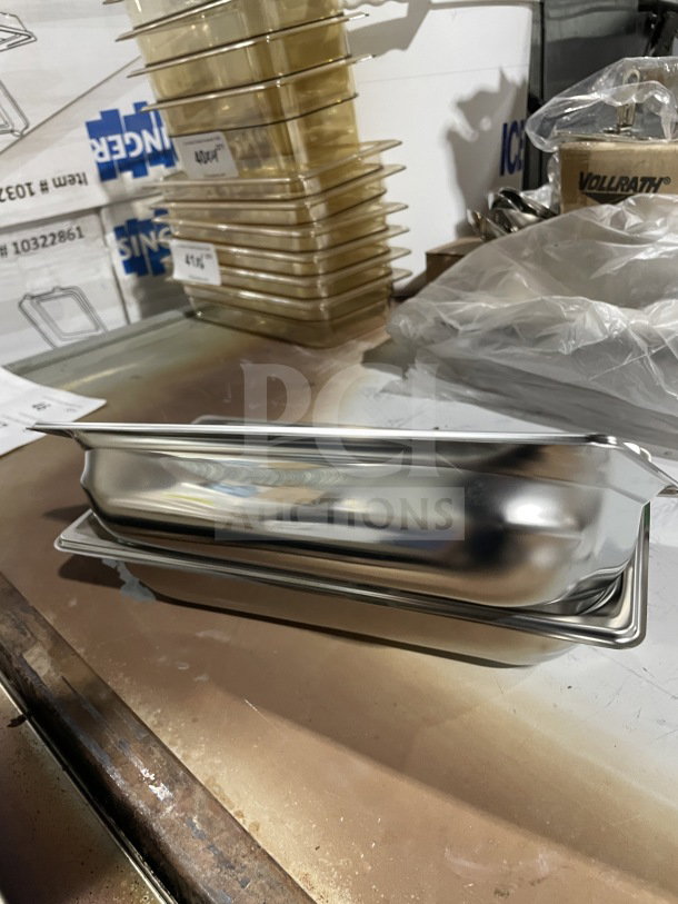 Brand new Vollrath model 90322 commercial stainless steel full-size steam pan on a table, pristine condition.