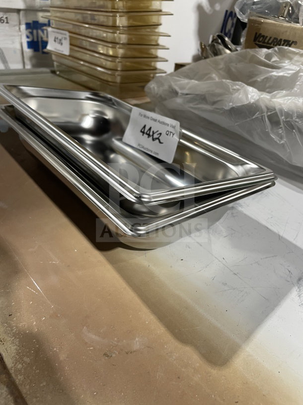 Brand new Vollrath stainless steel full-size steam pan, model 90322. Unused, shiny condition with auction tag shown.