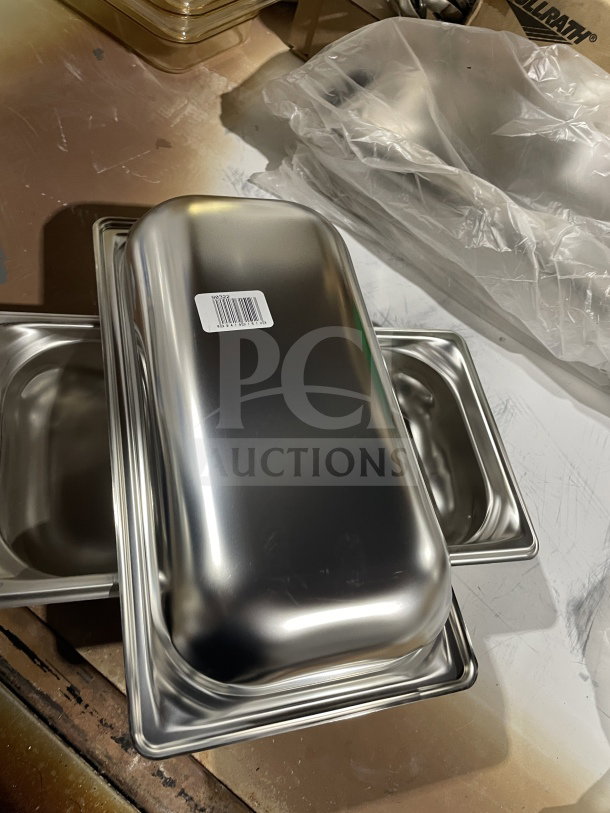 Brand new Vollrath stainless steel steam pan, model 90322, with barcode label. Unused commercial kitchenware.