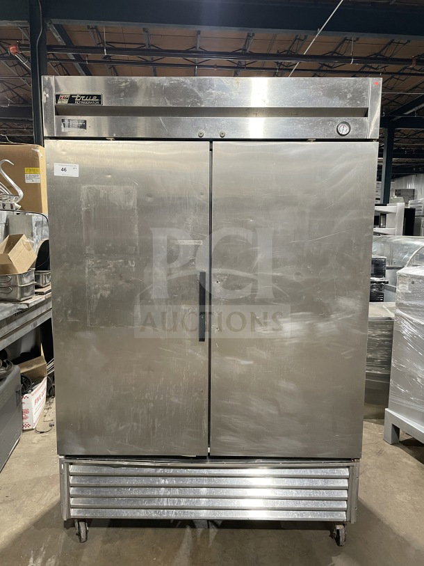 True T-49 commercial stainless steel 2-door refrigerator on casters, Energy Star certified, with poly-coated wired rack.