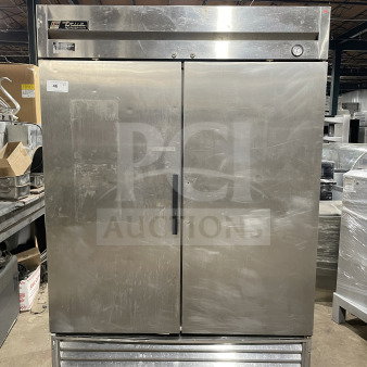 True T-49 commercial stainless steel 2-door refrigerator on casters, Energy Star certified, with poly-coated wired rack.