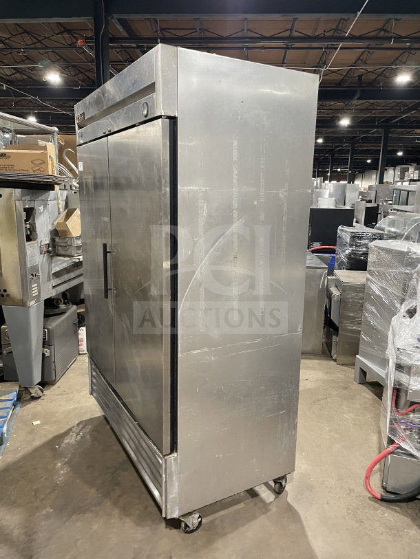 True T-49 stainless steel 2-door commercial refrigerator on casters, SN: 1111855, Energy Star certified, with poly coated racks.