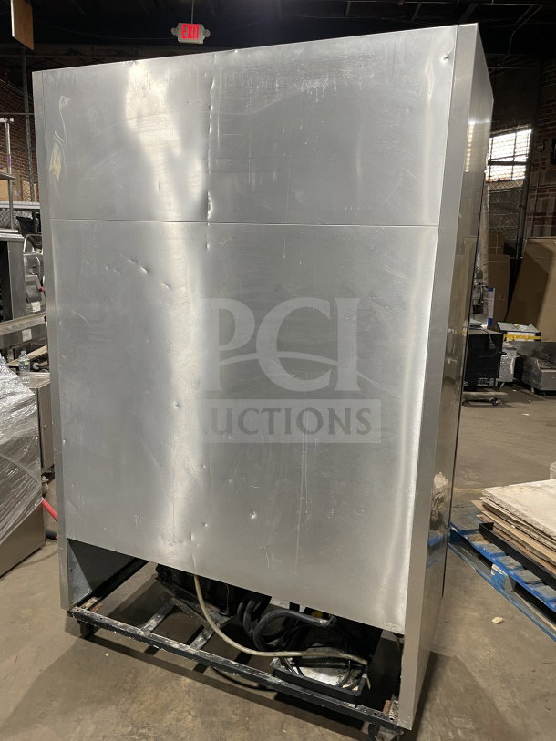 True T-49 commercial refrigerator, stainless steel, 2 solid doors, Energy Star certified, poly-coated racks. On casters.