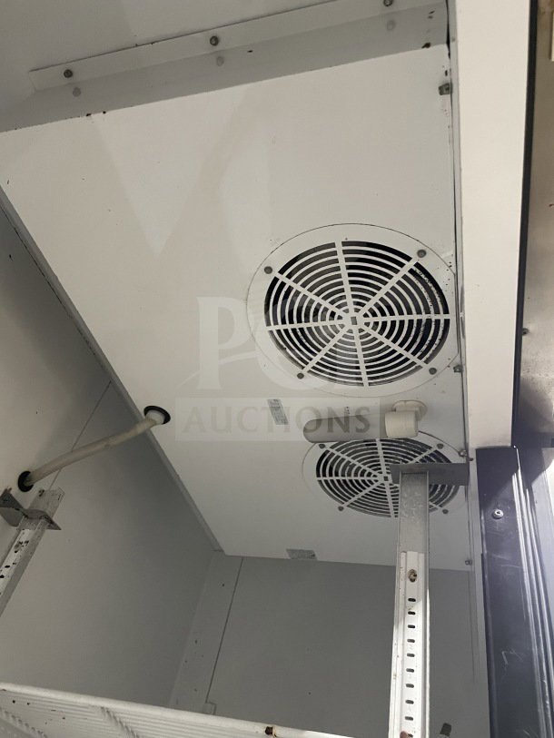 True T-49 commercial reach-in stainless steel 2-door refrigerator, Energy Star certified, with poly coated wired rack and casters.