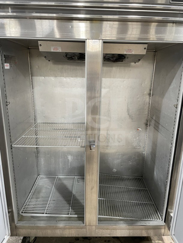 Victory FAA2057 reach-in electric freezer, 2 solid doors, poly-coated wired racks, on casters, 115V, SN: 09638V100.