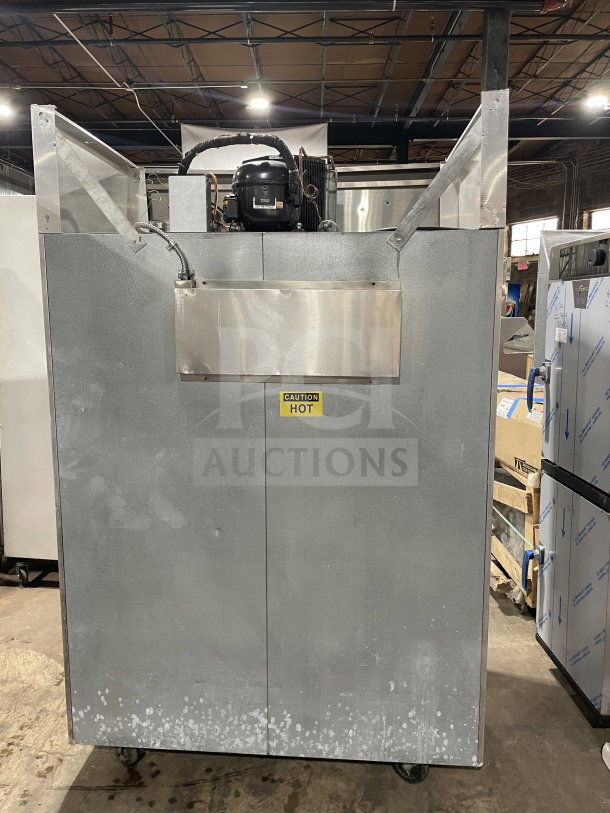 Victory Commercial 2-Door Freezer, Model FAA2057, electric powered, on casters, with poly coated rack, "Caution Hot" label.
