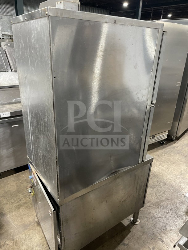 Vulcan C24GA10 stainless steel natural gas convection steamer. Dual cabinet, on legs, 120V, 1 phase. Model SN: 463023238.
