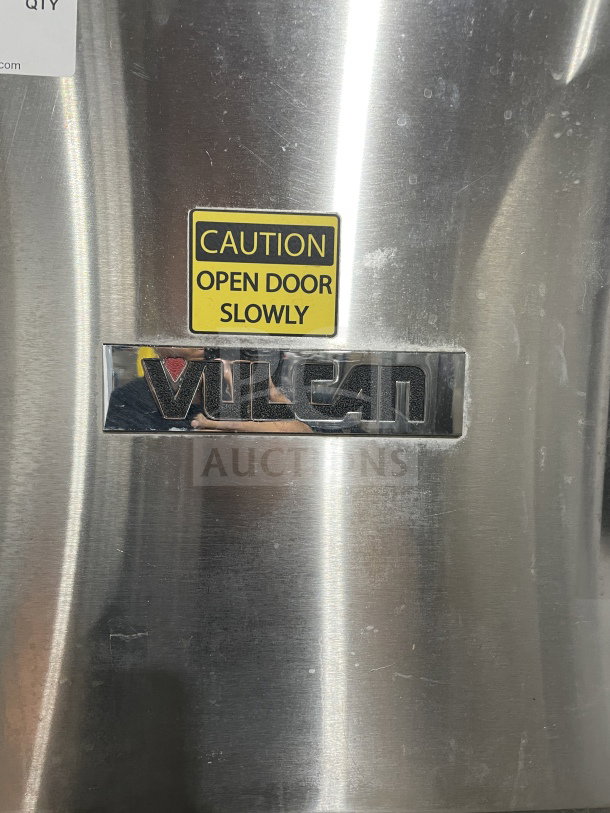 Vulcan C24GA10 commercial stainless steel convection steamer with caution label, natural gas powered, on legs.
