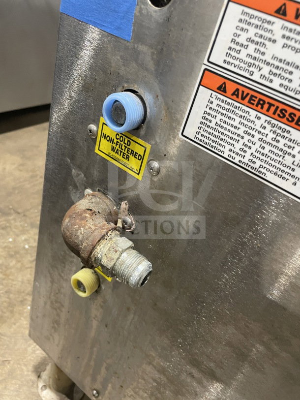 Vulcan C24GA10 stainless steel convection steamer with cold water inlet, rust on pipe, safety labels visible, on legs.