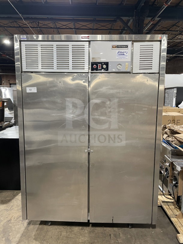 Victory commercial reach-in stainless steel refrigerator with two solid doors. Features Power Cool analog control console. In good condition, standing on legs.