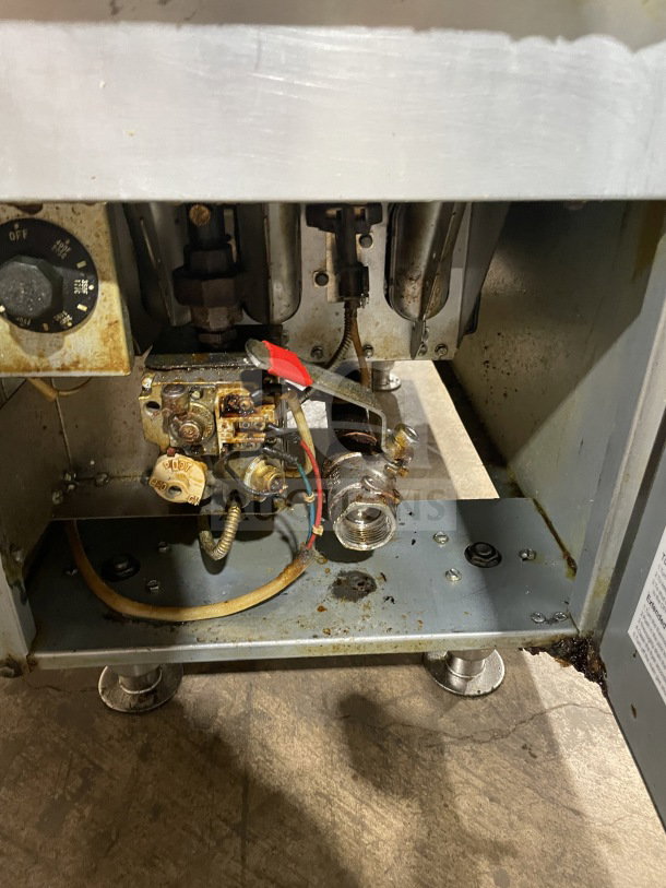CoolerDepot CTF3 commercial stainless steel deep fryer, natural gas powered, with backsplash and basket hanger, on legs.