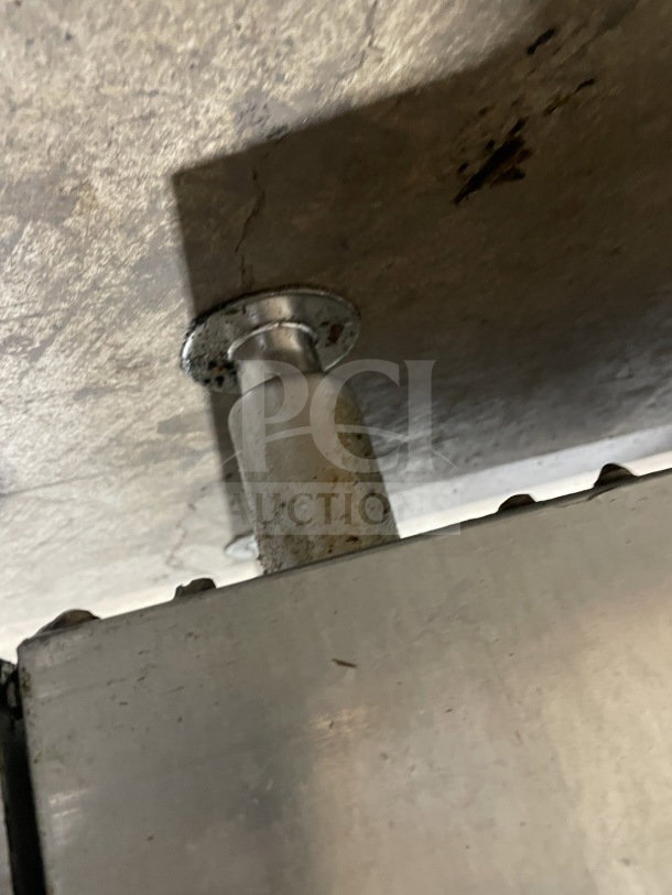 Stainless steel leg of CoolerDepot CTF3 fryer, showing mounting detail. Surfaces appear slightly worn.