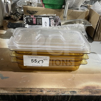 Clear stack of amber food storage pans with lids, labeled "55 QTY." New condition. Other kitchenware visible in background.