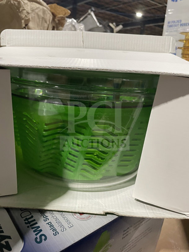 Brand new Zyliss SwiftDry green salad dryer in box. Commercial series, single-handed use, visible product details on packaging.