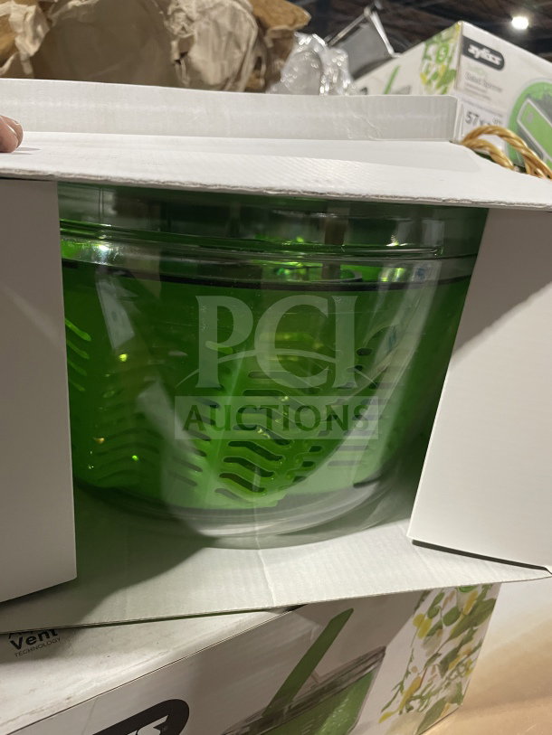 Brand new Zyliss SwiftDry Series salad dryer, green-style, single-handed operation, visible in original packaging.