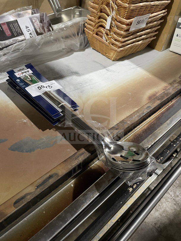 New Winco BSSN Commercial Stainless Steel Perforated Buffet Spoon in packaging, model BSSN, shown on auction shelf.