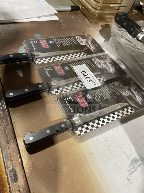Winco 6" forged carbon steel boning knife, model KFP-61, new in packaging. Features POM handle, NSF certified.