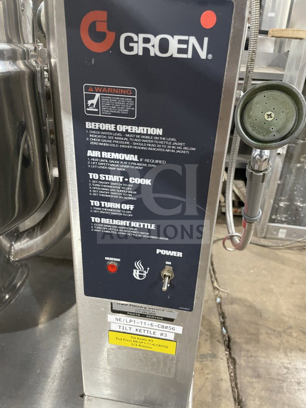 Groen TDH48 commercial stainless steel tilting soup kettle, natural gas powered, on stand, serial number 93724, 120V, 1-phase.