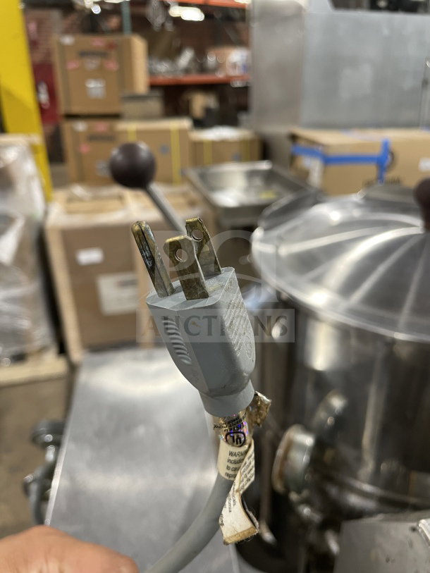 Groen TDH48 commercial stainless steel natural gas tilting soup kettle on stand, shown with plug and visible warning labels.