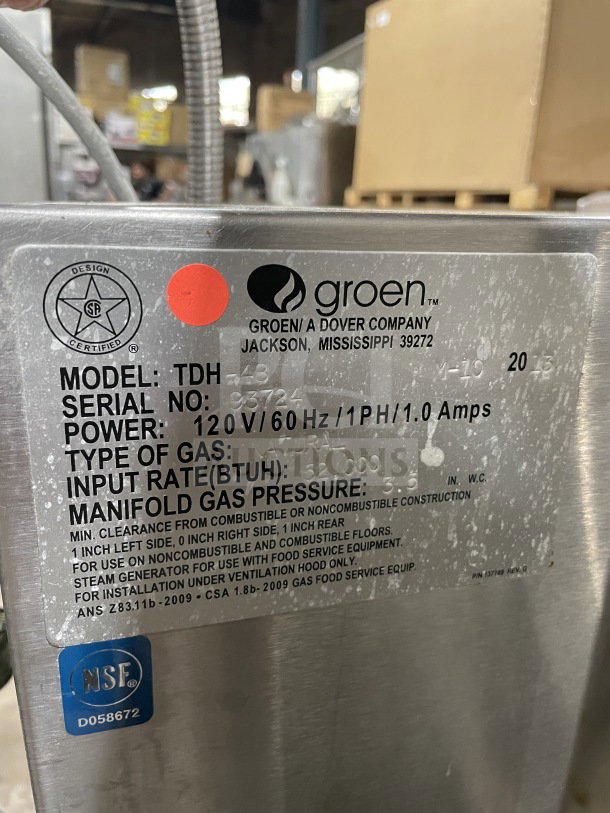 Groen TDH-48 stainless steel tilting soup kettle, natural gas, 120V. Model info and serial number visible. On stand. NSF certified.