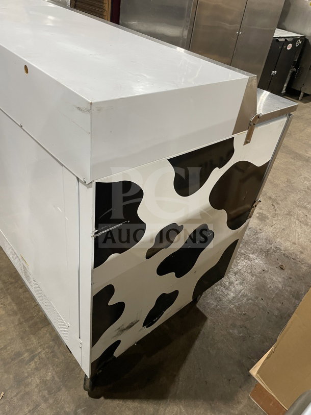 Beverage-Air SMF49Y commercial milk cooler, stainless steel, cow print, one-sided forced air, 115V, good condition.