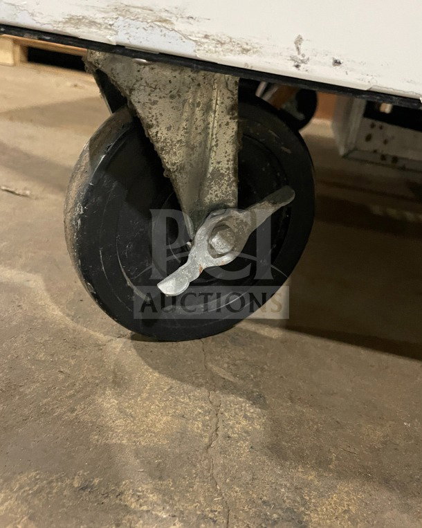 Beverage-Air SMF49Y milk cooler wheel detail, showing caster condition and structure.