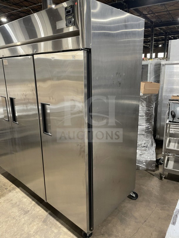 True 78" stainless steel 3-door freezer, model TR3F-3S, on casters, with chrome plated wired rack, excellent condition.