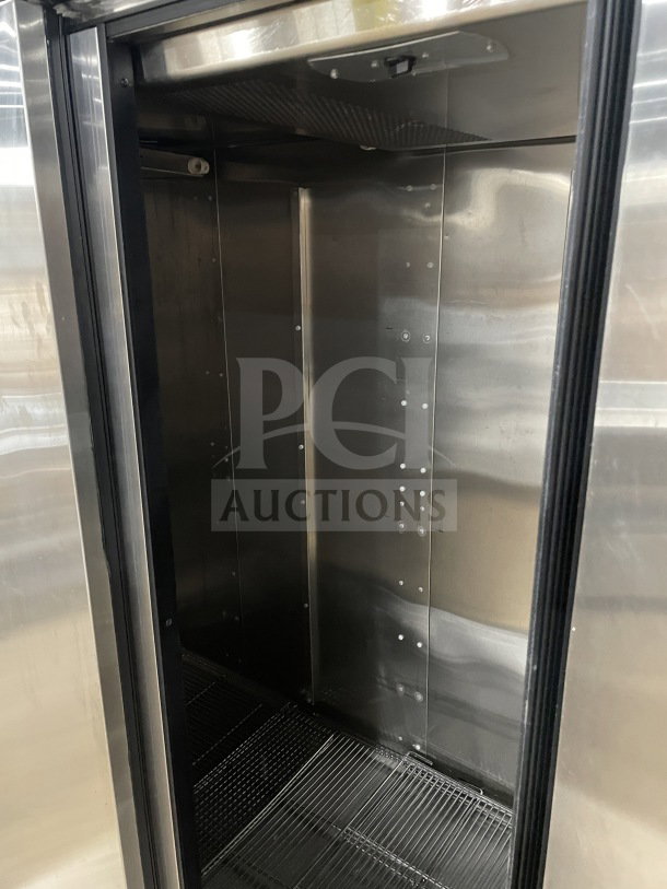 True 78" Commercial Reach-In Stainless Steel Spec Series Freezer Model TR3F-3S, solid 3 doors, chrome-plated rack, on casters.