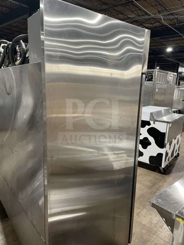 True 78" Commercial 3-Door Stainless Steel Freezer, Model TR3F-3S, on casters, with chrome-plated wire rack.