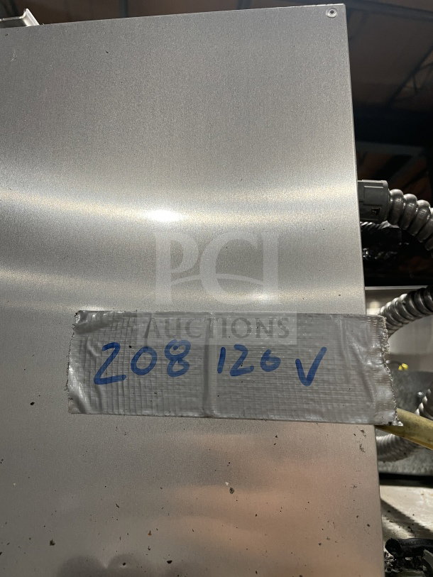 True 78" Commercial Spec Series 3-Door Freezer, Model TR3F-3S. Stainless steel, chrome racks, on casters, 115/208-230V. Serial: 5298083. Tape indicates "208 126V".