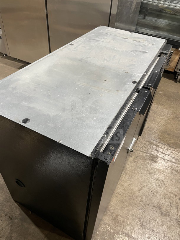 Beverage Air BB48Y1B commercial black 2-door bar cooler with poly coated racks. Model SN: 9903231, 115V, 1Phase. Solid used condition.