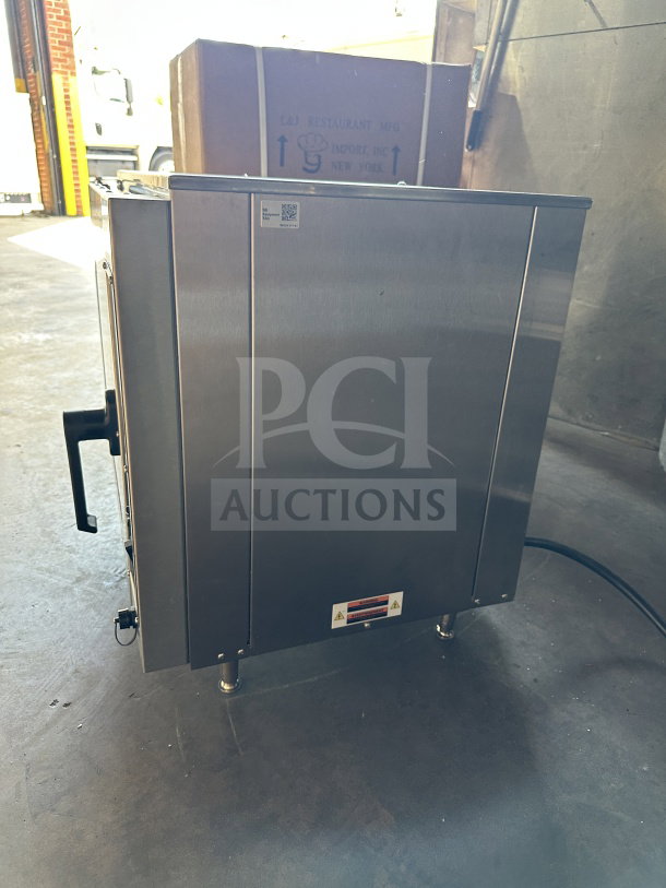 Doyon DCOT5 stainless steel convection oven, half size, electric, on legs, 208V, single phase, excellent condition.