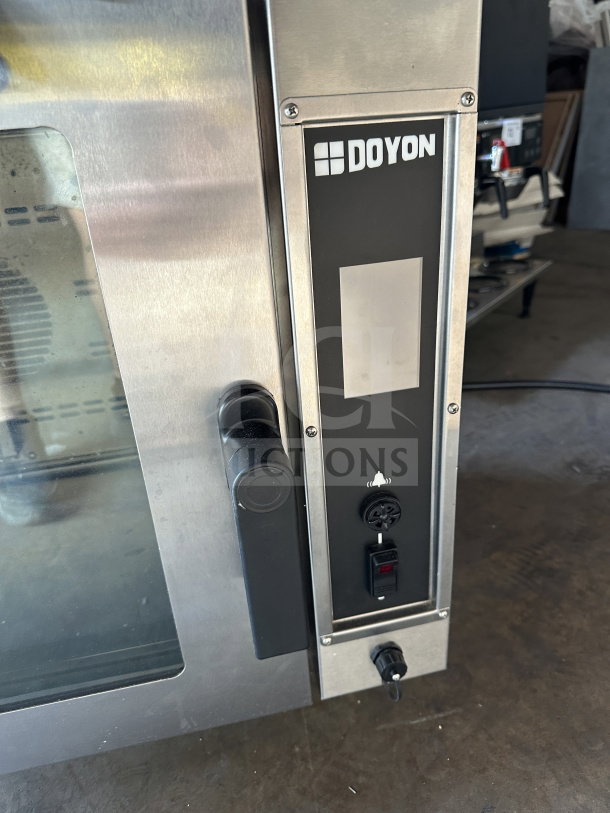 Doyon DCOT5 commercial stainless steel convection oven, electric, half-size, countertop model, 208V 1 phase, on legs.