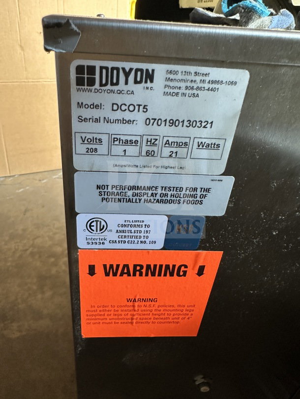 Doyon commercial stainless steel convection oven, model DCOT5. Features 208V, 1 phase. Includes legs. Serial: 070190130321.