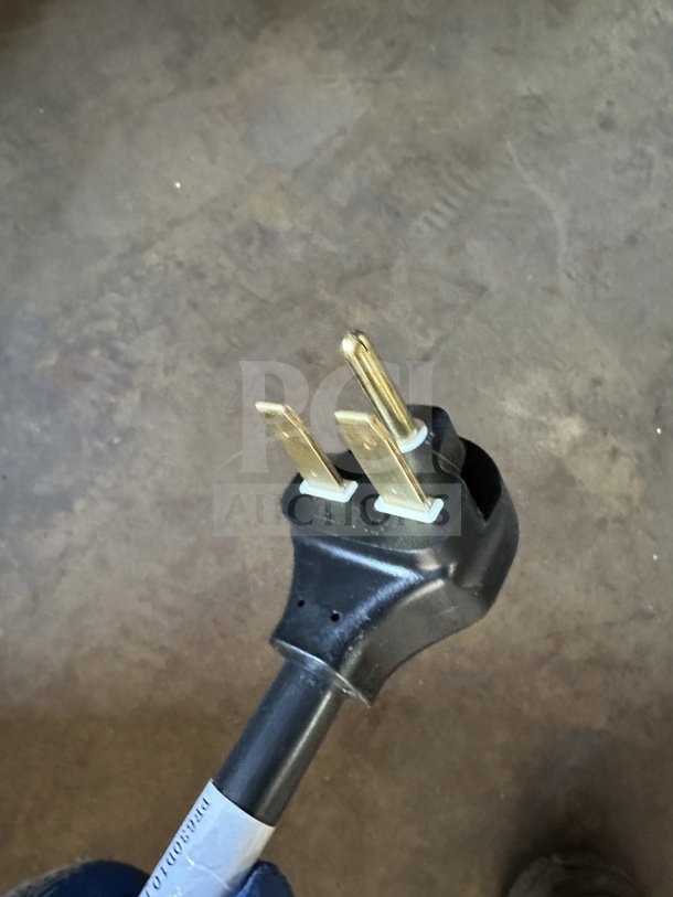 Close-up of power plug for Doyon DCOT5 convection oven, showing a 208V 1-phase design. Black plug with gold prongs.