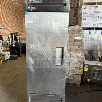 True T-23F commercial stainless steel single door reach-in freezer, Energy Star certified, with poly-coated wired rack, on casters.