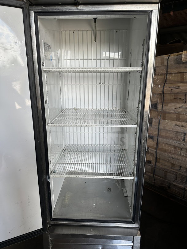 True T-23F commercial stainless steel single door reach-in freezer, Energy Star certified, with poly coated wired racks, on casters.