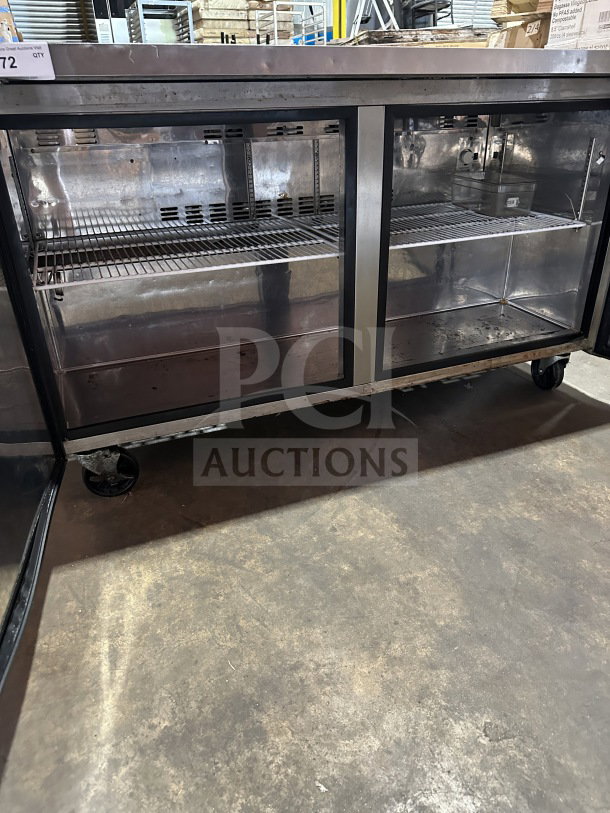 Master Bilt Fusion Series 2 Door Undercounter Freezer, Model UF60, stainless steel, poly-coated wire racks, on casters.