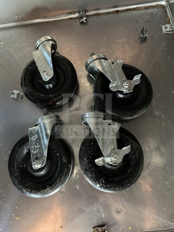 Four casters for Turbo Air Commercial Freezer, black wheels, metal fixtures, used condition, suitable for model M3F47-2.