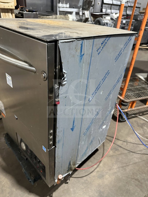 Noble WAREFORCEUL-30 undercounter dishwasher in stainless steel with visible signs of wear. Model: WAREFORCEUL30, 115V, 1 Phase.