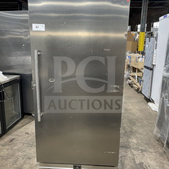 Kelvinator Commercial stainless steel freezer, model KCBM180FQYA, Energy Star certified, single door, on casters, with rack.