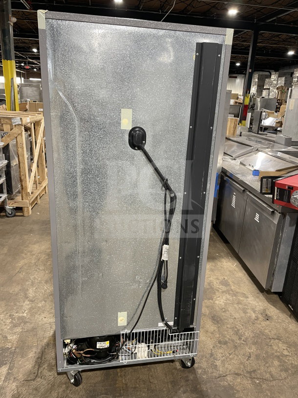Kelvinator commercial stainless steel single door reach-in freezer, Model KCBM180FQYA, Energy Star certified, on casters.