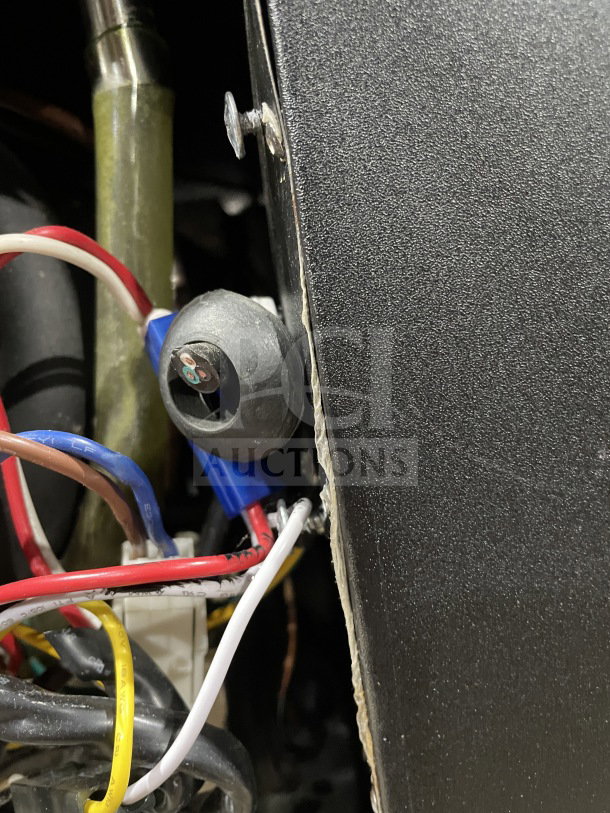 Close-up of internal wiring of Avantco 95" Commercial Beer Bottle Cooler, Model 178JBC95B, showing electrical connections.